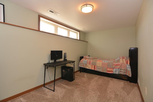 bedroom featuring carpet, visible vents, and baseboards