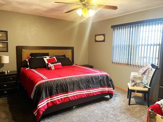 bedroom with carpet, a ceiling fan, and baseboards