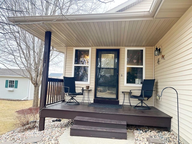 view of exterior entry featuring a porch