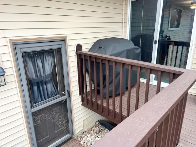 wooden deck featuring area for grilling