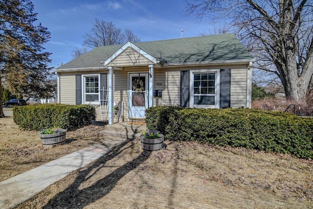 bungalow with a shingled roof