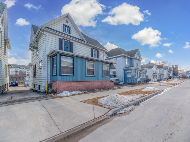 american foursquare style home with a residential view