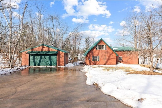 yard covered in snow with an outbuilding