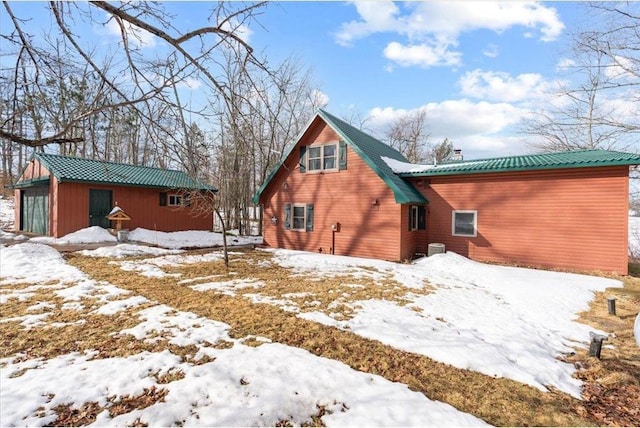 34239 Mcgraw Lake Rd, Danbury, WI 54830 - snow covered rear of property featuring an outbuilding and metal roof
