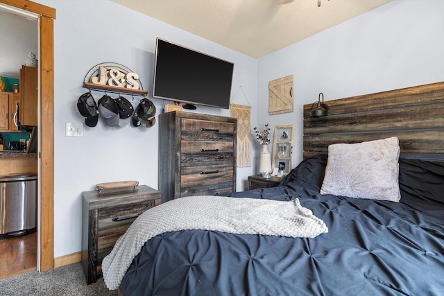 bedroom with carpet and baseboards