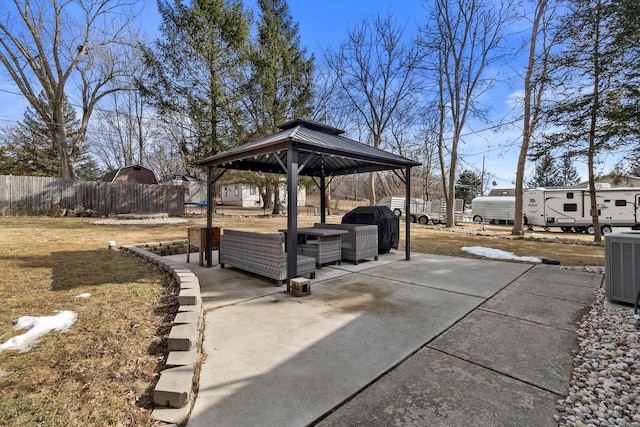 view of patio / terrace with cooling unit, fence, an outdoor living space, a grill, and a gazebo