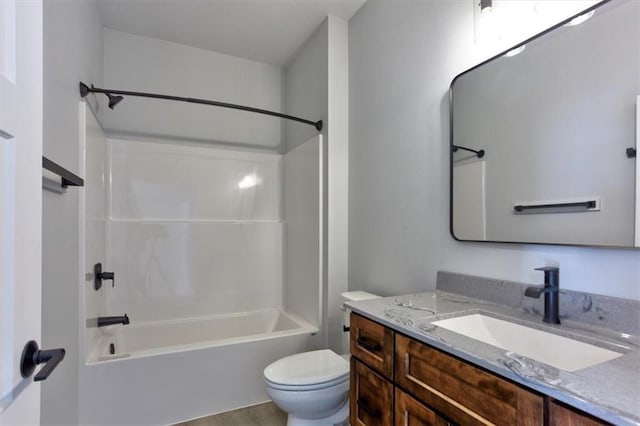 bathroom featuring shower / washtub combination, vanity, and toilet