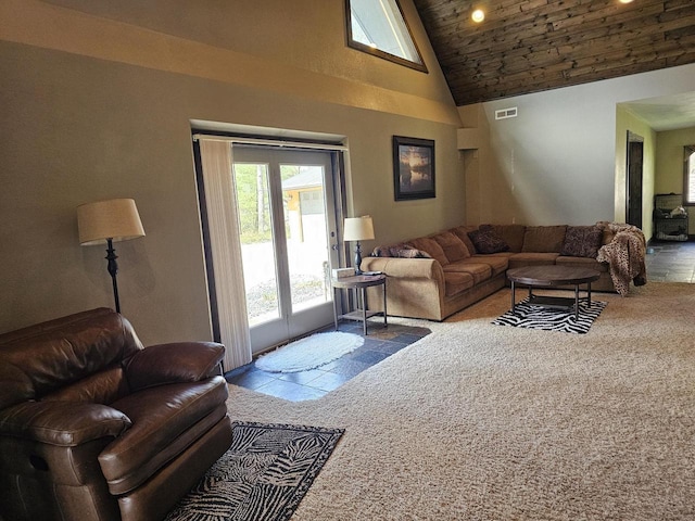 living area with high vaulted ceiling, wooden ceiling, and visible vents