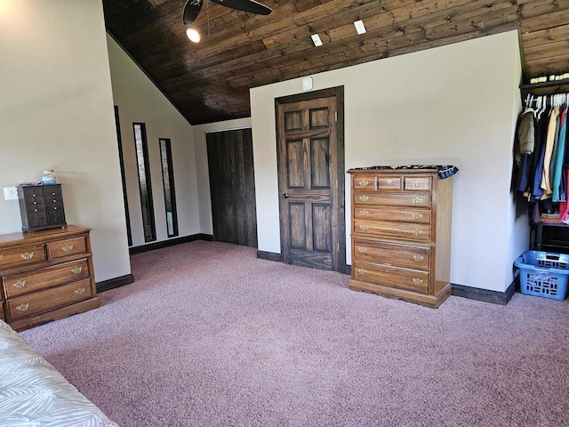 bedroom with carpet, wood ceiling, baseboards, and vaulted ceiling