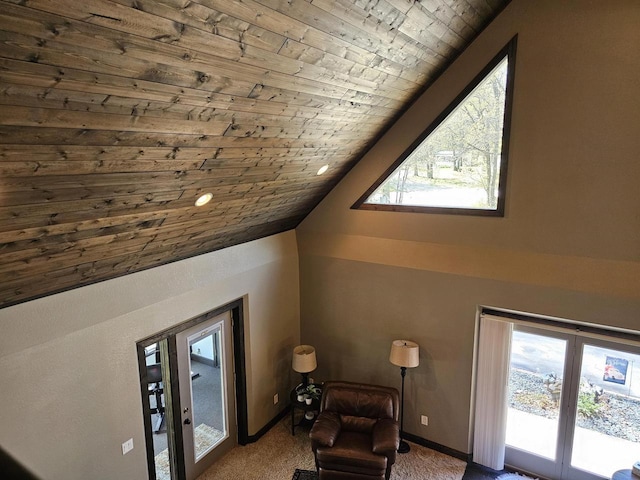 sitting room featuring wood ceiling, a healthy amount of sunlight, carpet flooring, and vaulted ceiling