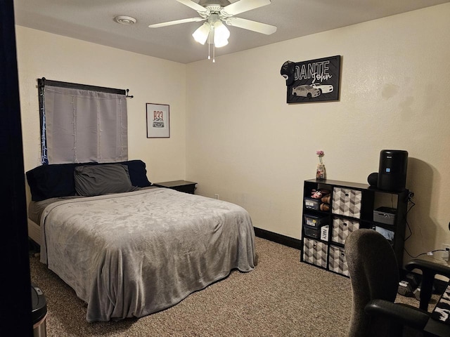 carpeted bedroom with baseboards and a ceiling fan