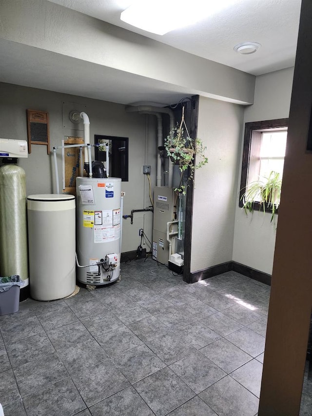 utility room with gas water heater