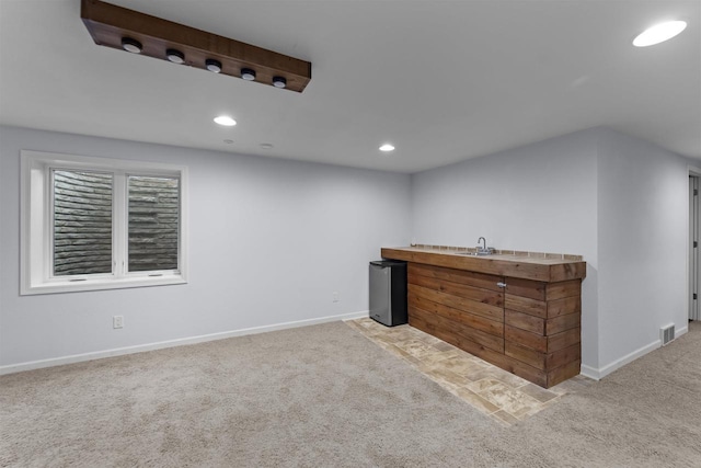 bar featuring carpet, baseboards, and recessed lighting