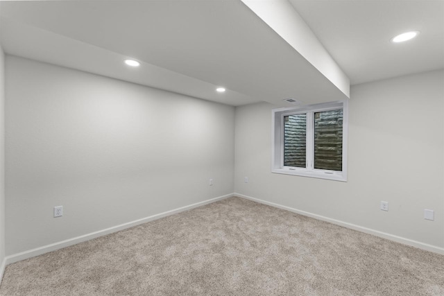 below grade area with recessed lighting, carpet flooring, and baseboards