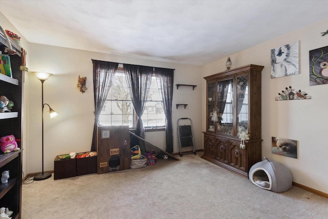 interior space featuring carpet floors and baseboards