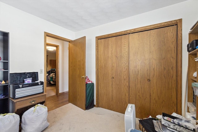 carpeted bedroom with a closet