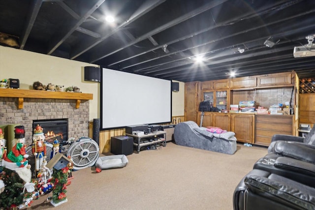 home theater with carpet floors and a fireplace