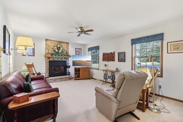 living room with light carpet, a brick fireplace, plenty of natural light, and baseboards