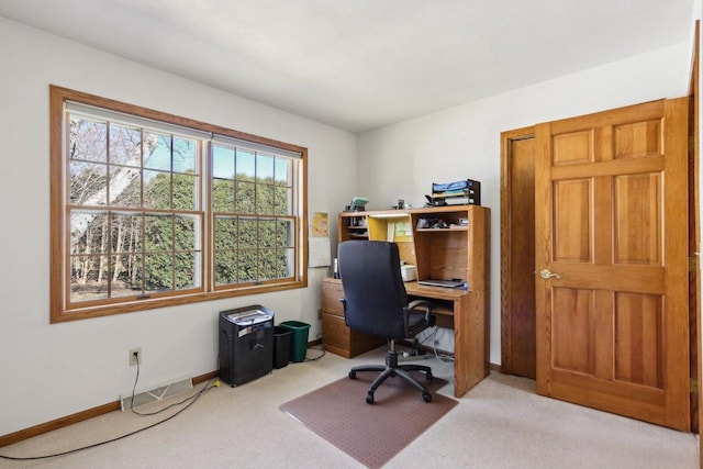 office with carpet floors, visible vents, and baseboards