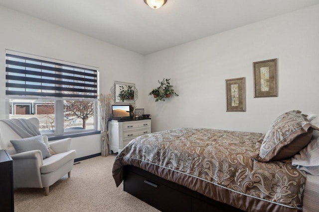 carpeted bedroom with baseboards