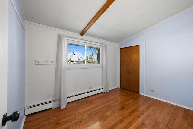 unfurnished bedroom with vaulted ceiling with beams, a baseboard radiator, and wood finished floors