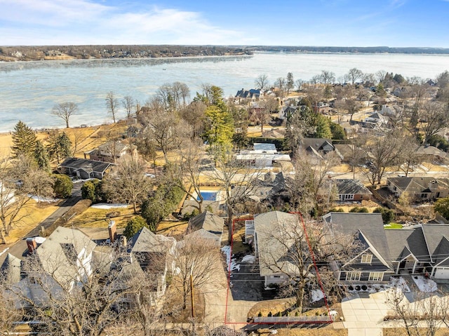 aerial view with a residential view and a water view