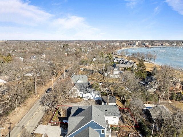 birds eye view of property featuring a residential view and a water view