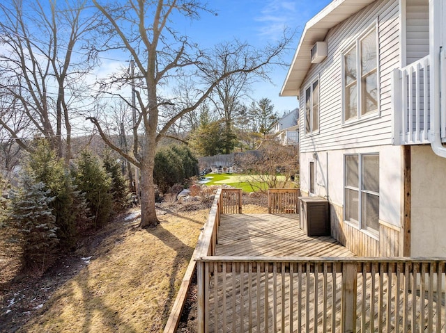 wooden terrace featuring fence