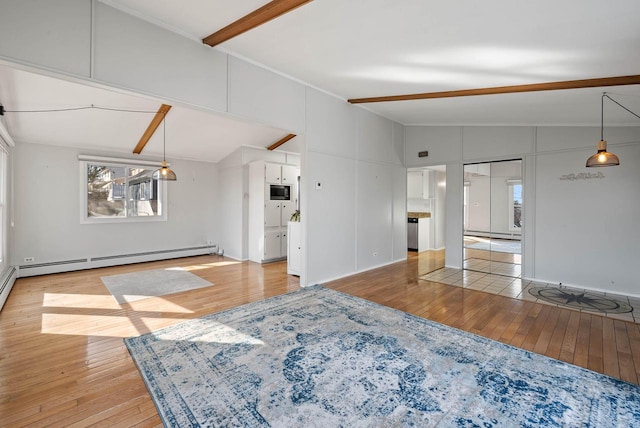 living area with wood-type flooring, vaulted ceiling with beams, and baseboard heating