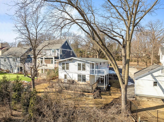 rear view of house with fence