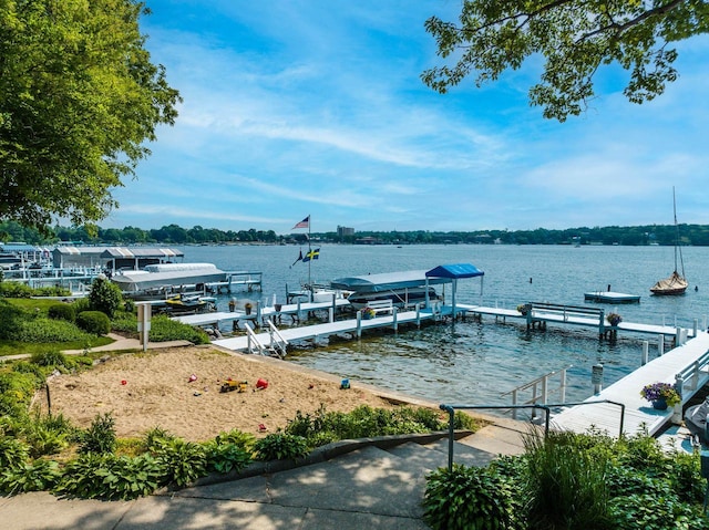 dock area featuring a water view and boat lift