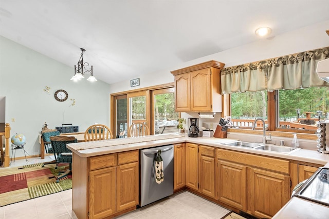 kitchen with lofted ceiling, a peninsula, a sink, light countertops, and dishwasher