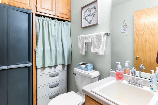 half bath with toilet and vanity