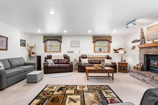 living area with light carpet, a fireplace, and recessed lighting