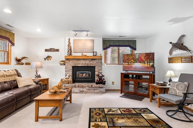 living room featuring recessed lighting, visible vents, baseboards, a brick fireplace, and carpet