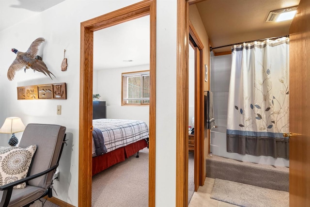 interior space with visible vents and connected bathroom