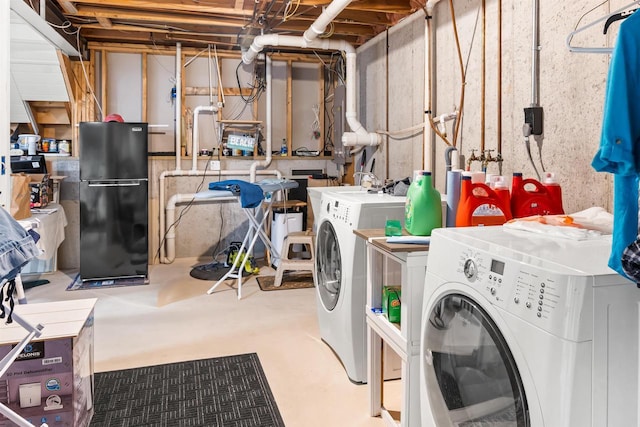 laundry area featuring laundry area and washer and clothes dryer