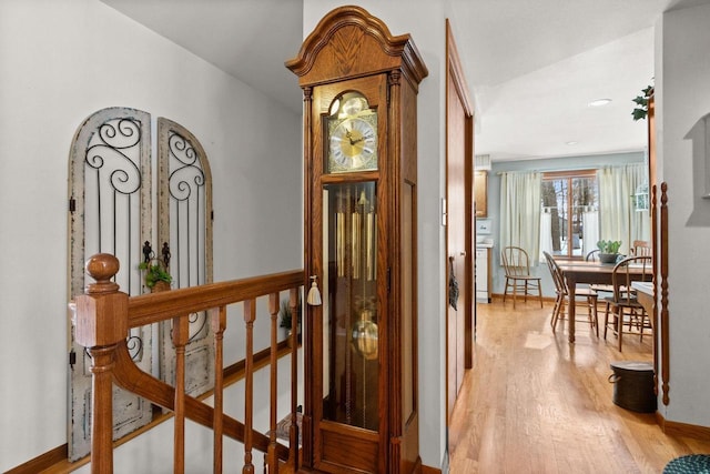 interior space featuring light wood finished floors and baseboards