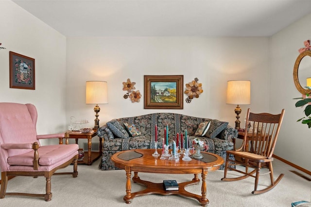 living room featuring carpet, visible vents, and baseboards