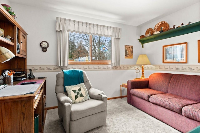 living area featuring baseboards and light colored carpet