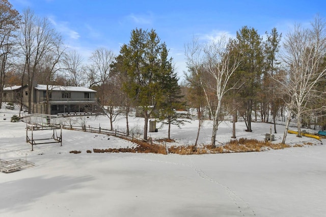 view of yard layered in snow