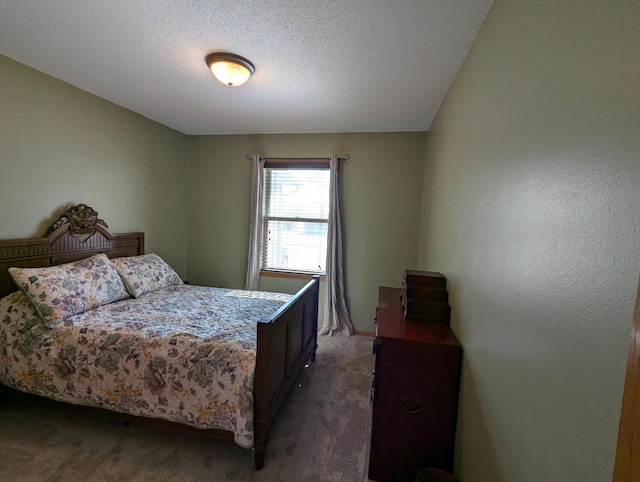 carpeted bedroom featuring a textured ceiling