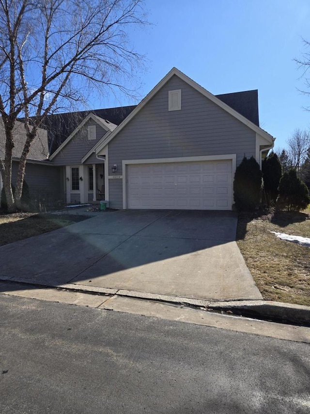 view of front of home featuring a garage and concrete driveway