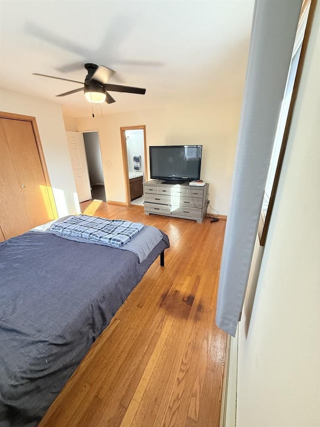 bedroom featuring light wood-style flooring and ceiling fan