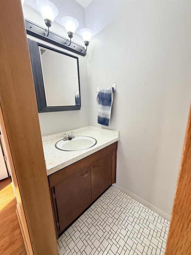 bathroom featuring vanity and baseboards