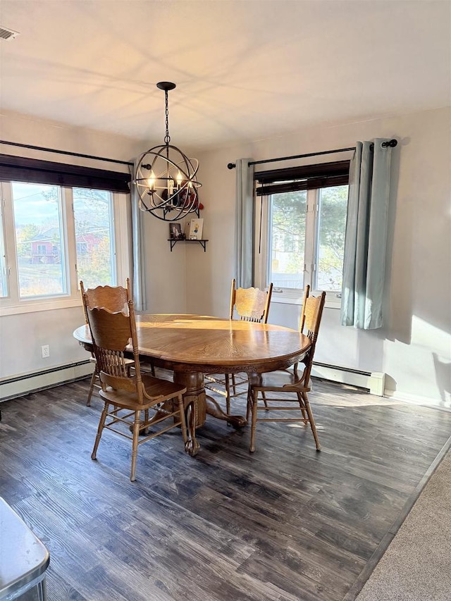 dining area featuring baseboards, a baseboard heating unit, and dark wood-style flooring