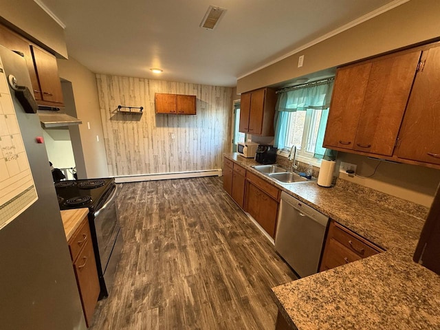 kitchen with a baseboard heating unit, stainless steel appliances, dark wood-type flooring, a sink, and visible vents