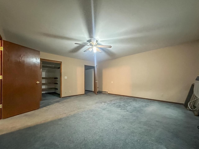 unfurnished bedroom featuring carpet, a ceiling fan, and baseboards