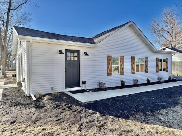 view of front of house featuring roof with shingles