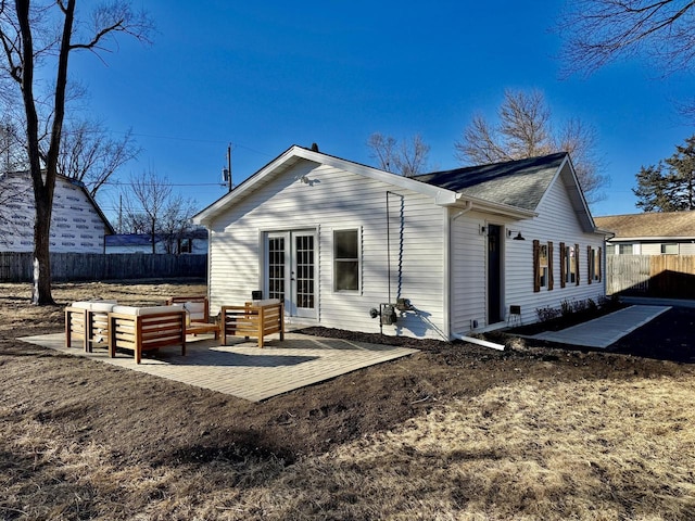 rear view of house featuring a patio, french doors, outdoor lounge area, and fence